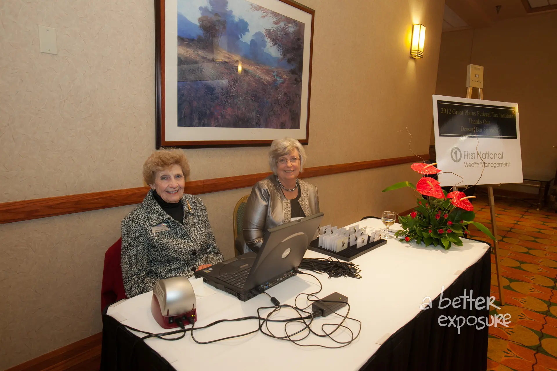 Registration assistants check in guests at the dinner for which First National Wealth Advisors sponsored a dessert bar