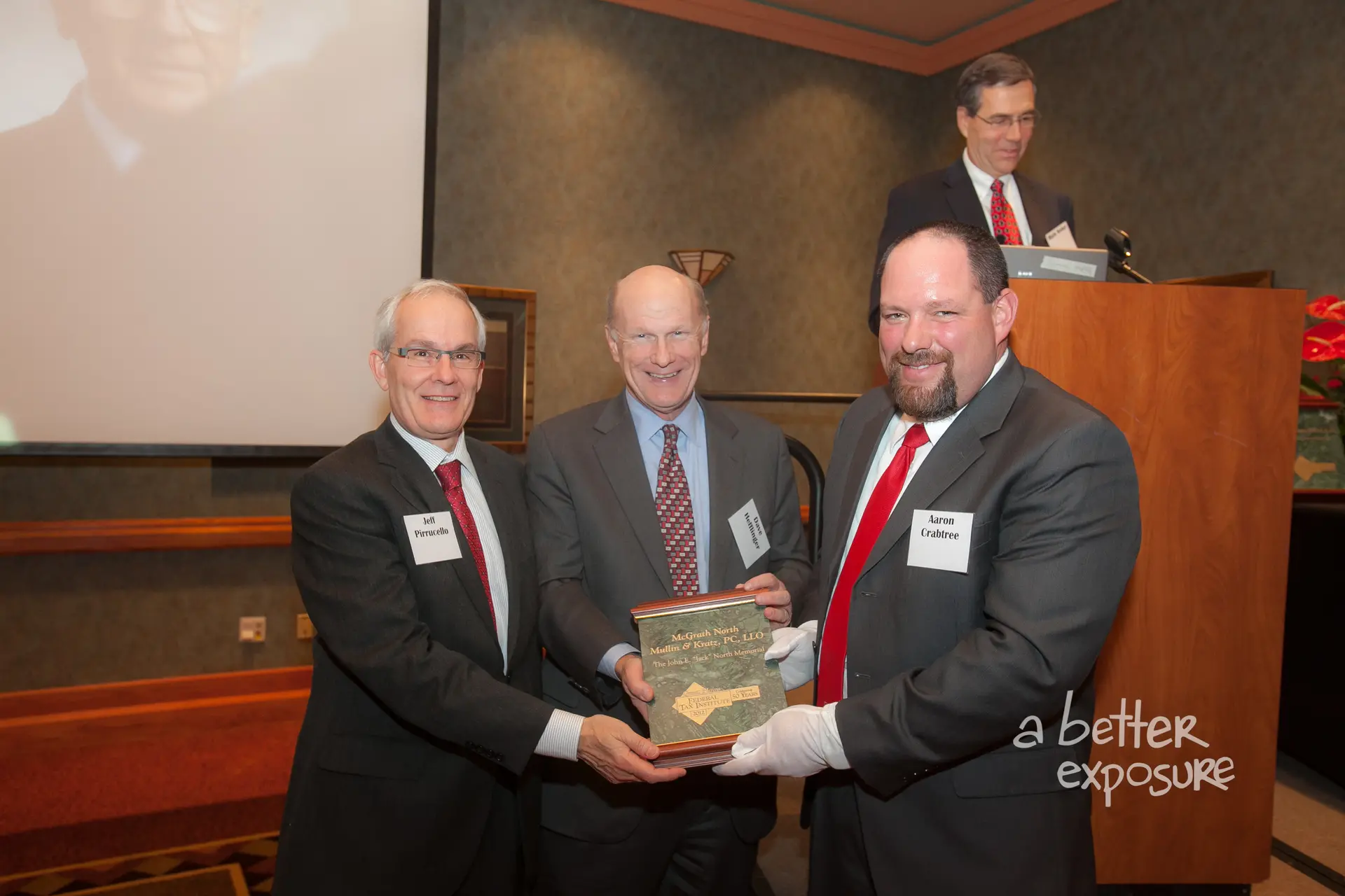 President Aaron Crabtree presents Jeff Pirruccello and David Hefflinger with a plaque